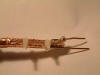 Solder another wire(piece of braid) to the other half of the copper sheath. Attach solder tags as close as possible to cable eg 3-5 mm.Small cable ties should hold the 2 halves of copper sheath firmly to the insulating centre.